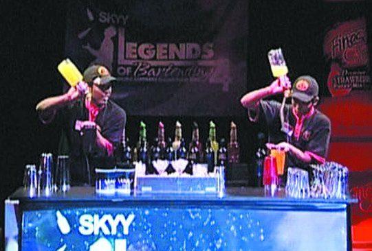Flair bartenders performing on stage at a Legends of Bartending competition