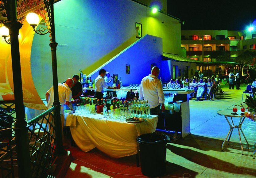 Vibrantly lit bar setting at an international bartending event