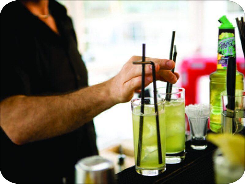 Bartender crafting cocktail